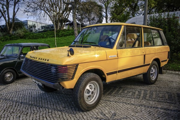 Lisbon, Portugal, Jan 20, 2024: A classic yellow Land Rover Range Rover car with extra front