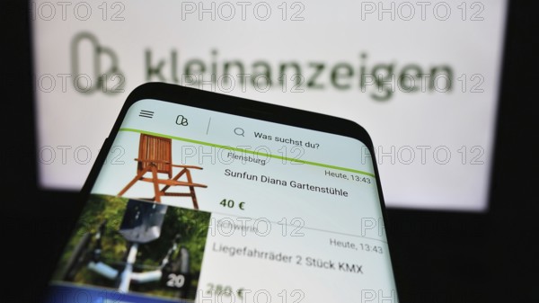 Stuttgart, Germany, 04-13-2024: Mobile phone with website of German classifieds platform company