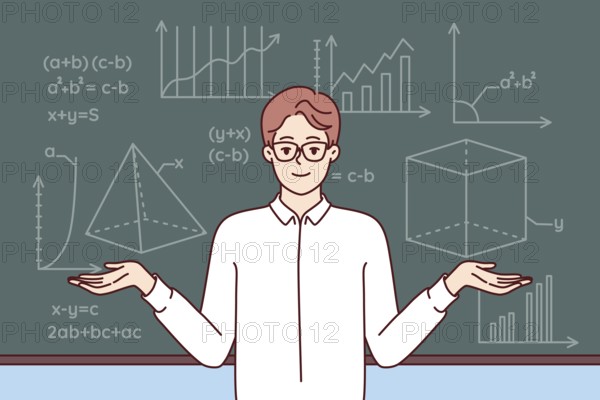 Man mathematics teacher stands near school blackboard with formulas and geometric drawings. Young