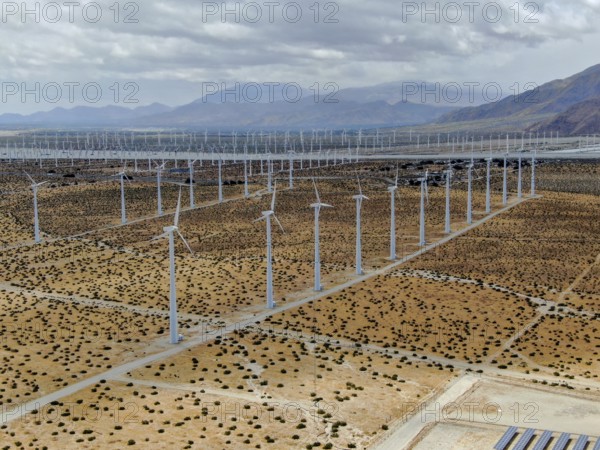 Aerial view of huge array of gigantic wind turbines spreading over the desert in Palm Springs wind