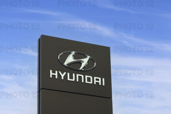 Hyundai Motor Company logo outside dealership. Hyundai is a South Korean multinational automotive