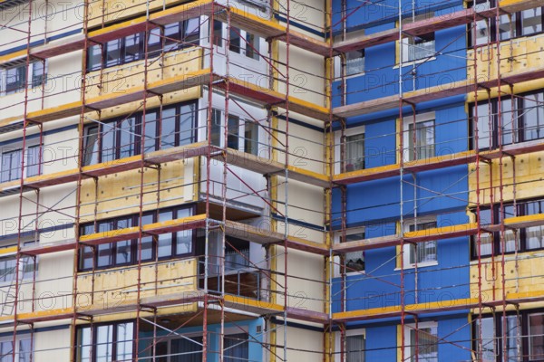 A residential building is being renovated. Insulation for energy saving and thermal insulation, A