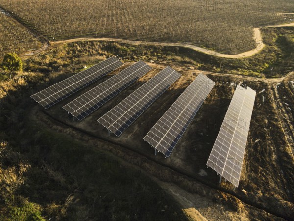 Aerial view of solar power plant solar panels on vineyard. Electric panels for producing clean