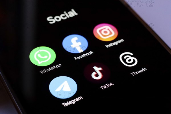 In this photo illustration, WhatsApp, Facebook, Instagram, Telegram, TikTok and Threads apps