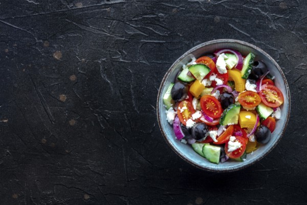 Greek salad. Fresh tomato, cucumber, bell pepper, Feta cheese, onion, and olives. Healthy summer
