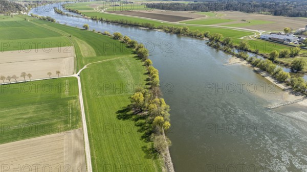 Greened bank areas with neighbouring fields and a meandering river (Danube) in a rural landscape,