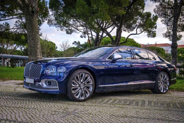 Lisbon, Portugal, Jan 20, 2024: Luxury Bentley Flying Spur Mulliner parked on a cobblestone road,
