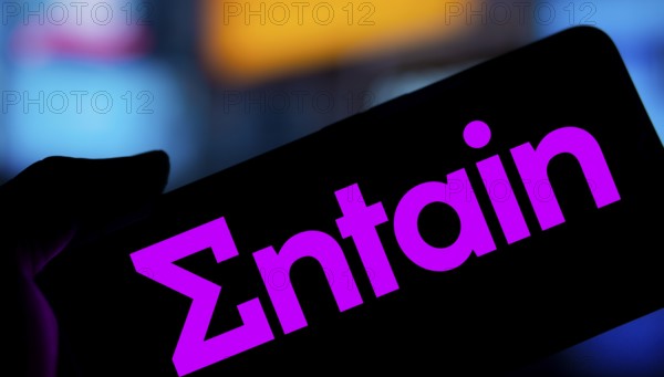 Dhaka, Bangladesh- 28 Nov 2024: Entain logo is displayed on smartphone.Entain plc is an