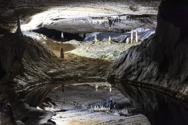 Pool of Reflections, stalactites reflected in a pool of water, stalactite cave, Ingleborough Cave,