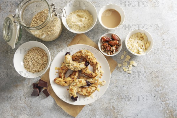 Healthy almond crescent cookies without sugar made from almonds, oat flakes and dates on a plate