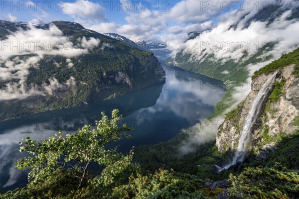 Gjerdefossen waterfall, at Ørnesvingen viewpoint, atmospheric clouds over the fjord in the morning
