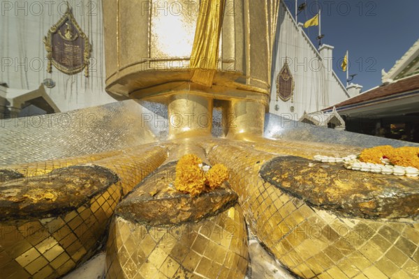 Feet of a 32 metre high standing Buddha decorated with glass mosaics and 24-carat gold, Luang Pho