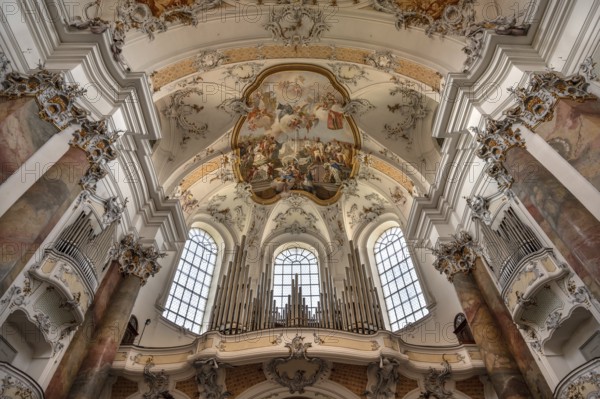 Organ loft and vault with ceiling frescoes in the baroque Basilica of St Alexander and Theodor,