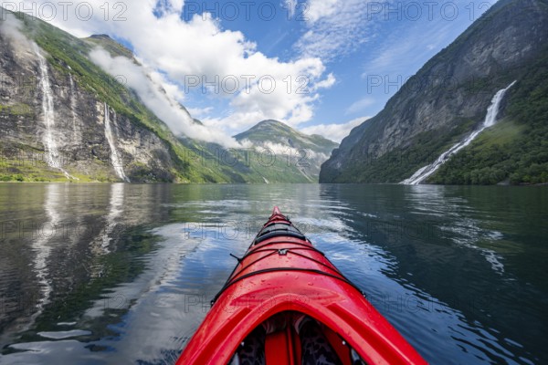 Kayak trip on the Geirangerfjord with waterfall The Seven Sisters and Freier Waterfall, tip of a