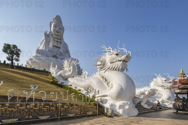 Chinese dragons line the steps up to the Guan Yin (Goddess of Mercy) statue at Wat Huay Pla Kang