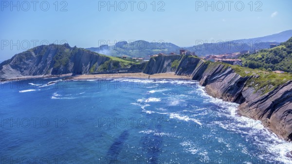 Breathtaking aerial view of zumaia's unique flysch coastline, showcasing its dramatic cliffs and