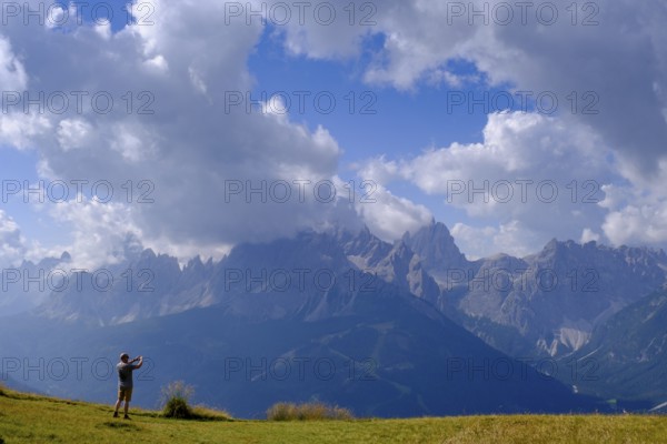 Mountaineer on the helmet, view of the Sesto sundial, Sesto, Dolomites, Val Pusteria, South Tyrol,