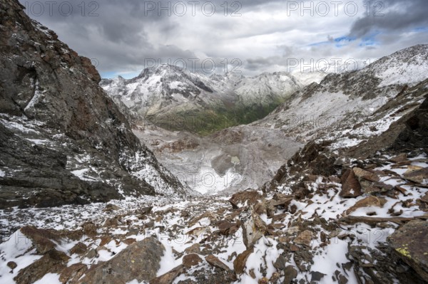 View of steep rocky mountain landscape with fresh snow in summer, in the Hornscharte, on the Wiener