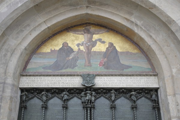Thesis door with tympanum and crucifix with Philipp Melanchthon and Martin Luther, wall mosaic,