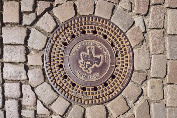 Manhole cover, dove of peace, 350 years of the Peace of Westphalia, 1648 to 1998, biblical symbol,