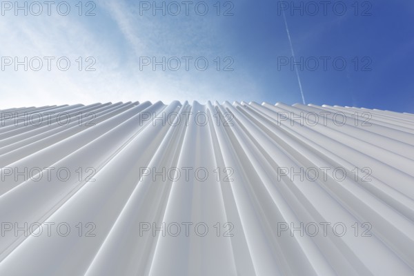 Modern white façade made of corrugated acrylic glass, Plexiglas, SANAA production hall, architect
