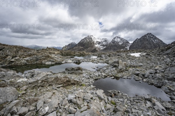 Small mountain lakes in a rocky mountain landscape, Niedere Gradenscharte, behind the summit of the