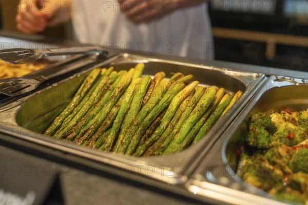 Asparagus and broccoli on a tray in a buffet setting in the kitchen, event and wedding location