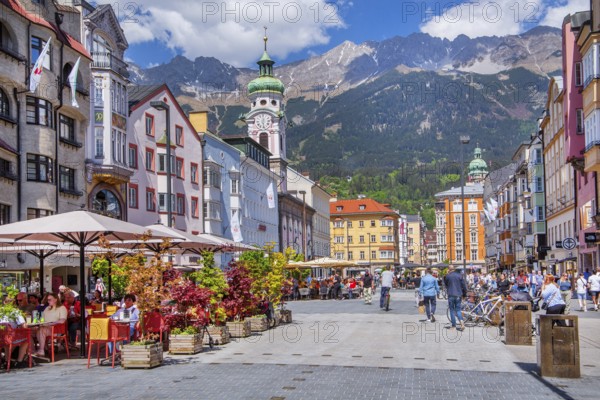 Street café on the pedestrian zone Maria-Theresien-Strasse in front of the Nordkette of the