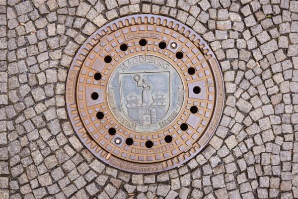 Manhole covers, paving stones, Magdeburg, state capital, independent city, Saxony-Anhalt, Germany,