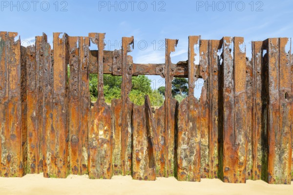 Old rusty broken steel sheet piling sea wall coastal defence, River Deben, Bawdsey, Suffolk,