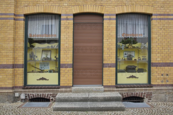 Shop window with colonial goods, shop, window, front door, Gräfenhainichen, Saxony-Anhalt, Germany,