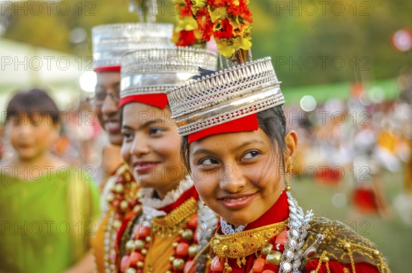 Shillong, Meghalaya, circa April 2012: Smiling girls in traditional costumes with large beads and