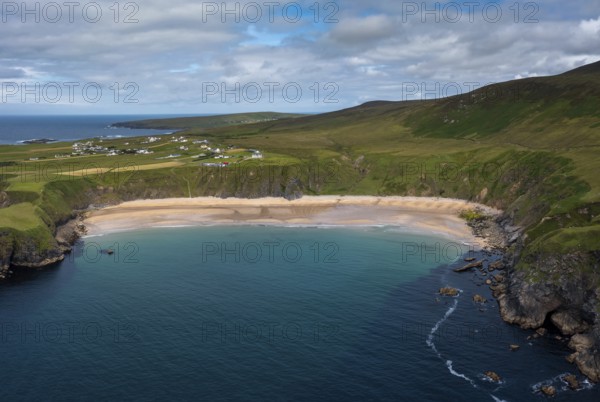 A drone aerial view of the beautiful Silver Strand and horseshoe bay at Malin Beg on the Wild