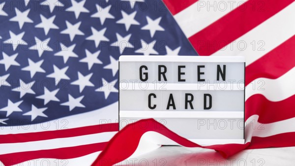 American flag. Lightbox with text GREEN CARD Flag of the united states of America. July 4th