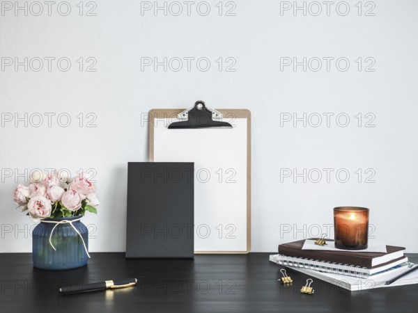 Empty chalkboard on table. Home office concept or mockup. Chalkboard mock up portrait format, copy