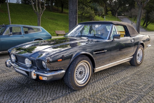Lisbon, Portugal, Jan 20, 2024: Classic brown Aston Martin V8 Volante grand tourer parked on a
