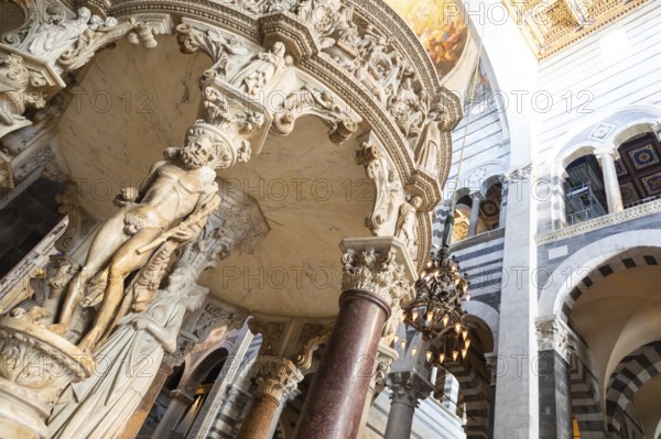 Pisa, Italy, 29 June 2023. Cathedral interior. The pulpit, Medieval art masterpiece by sculptor