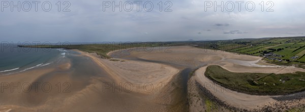 A panorama drone landscape view of the beautiful golden sand beach at Lacken Strand on the coast of