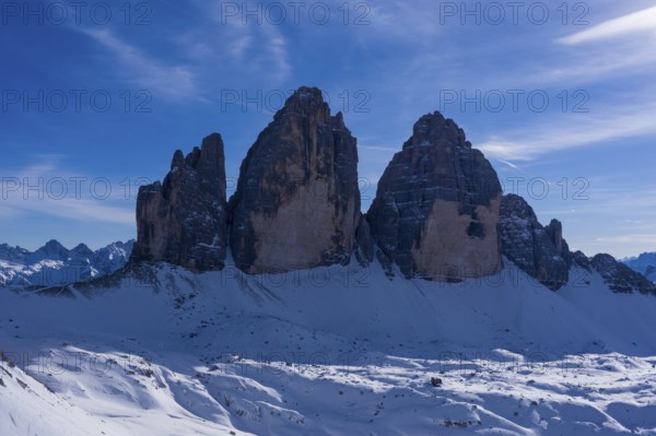 Tre Cime Di Lavaredo. The Three Peaks on Sunny Day in Winter. Aerial View. Sexten Dolomites, South