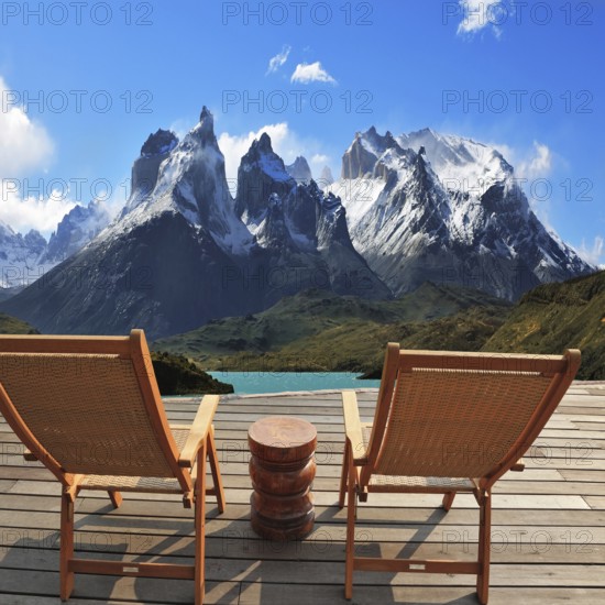Comfortable wooden chair - chaise lounges stand on a wooden platform. Lookout is arranged in front