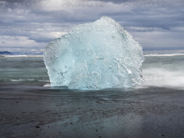 Diamond Beach, iceberg on black lava beach, near Jökulsarlon glacier lagoon, Vatnajökull National