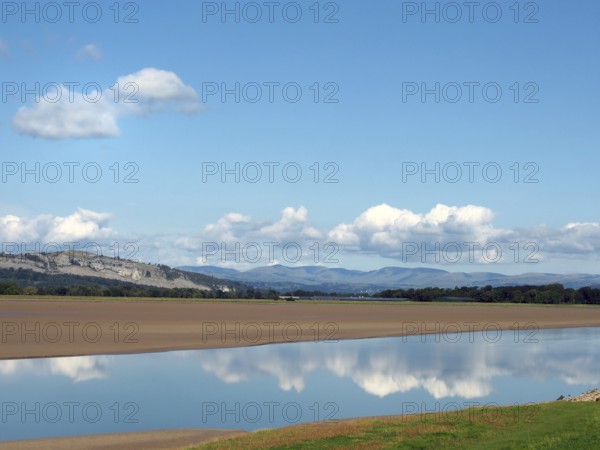 View of the river kent near arnside and sandside in cumbria with surrounding lakeland hills