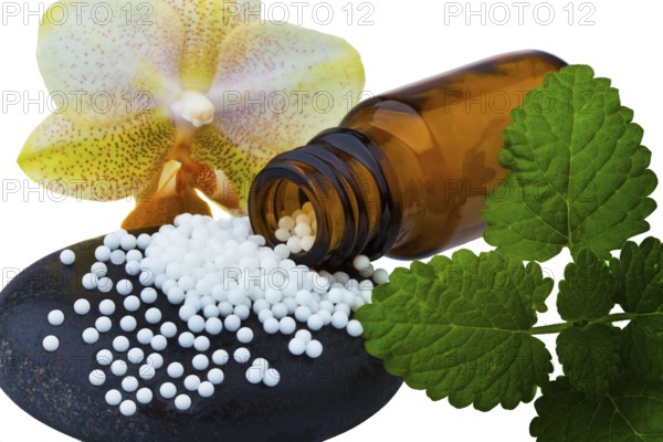 Homeopathy. Globules as alternative medicine. Lying on a stone, Homeopathy. Lying on a stone.