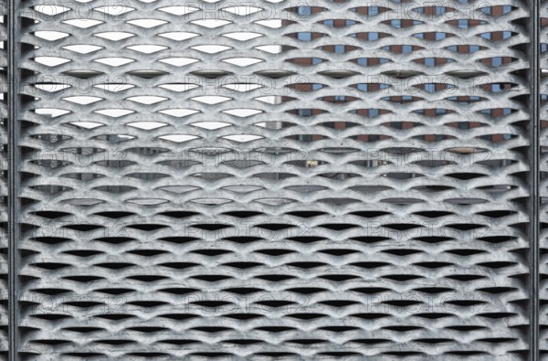 Leuven, Flemish Brabant, Belgium, 12 18 2021: Abstract close up of a metal grid with patterns,