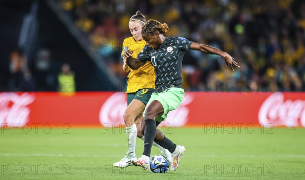 BRISBANE, AUSTRALIA, JULY 27: Caitlin FOORD of Australia and Christy UCHEIBE of Nigeria tackle as
