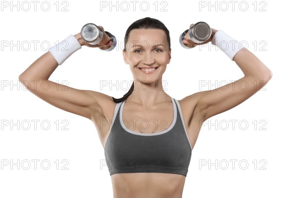 A sports woman with dumbbells looking at camera smiling isolated