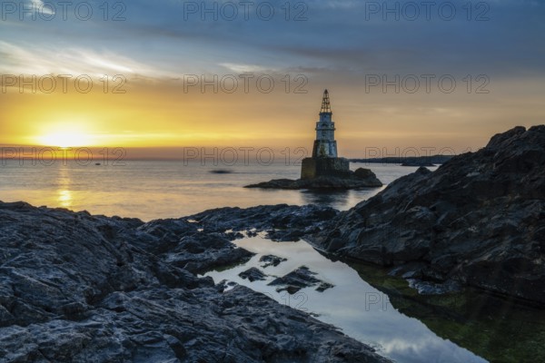The Athopol Lighthouse on the Black Sea coast of Bulgaria with tidal pools in the foreground at