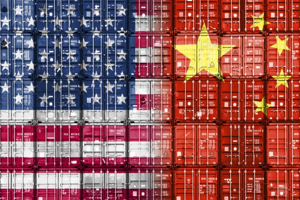 Stacked containers in US and Chinese national colours, symbolic photo of the trade war between the