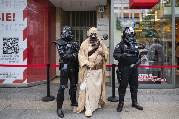 04.05.2024, Berlin, Germany, Europe, Star Wars fans in various costumes stand outside the Lego