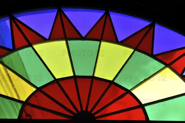 View of a colourful, wheel-shaped stained glass window with colourful segments, Havana, Cuba,